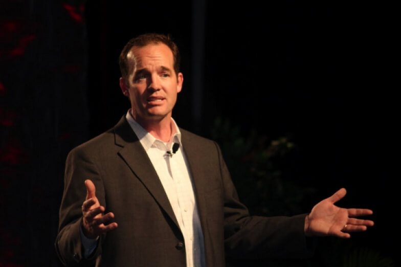 Thomas Dismukes speaking on stage